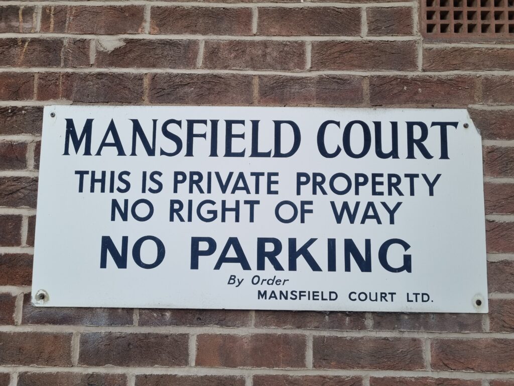 Sign that reads:
MANSFIELD COURT
THIS IS PRIVATE PROPERTY
NO RIGHT OF WAY
NO PARKING