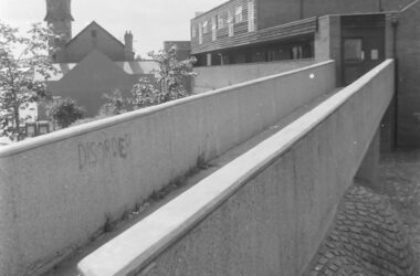 The walkway from Woodborough Road into the Marple Square flats.