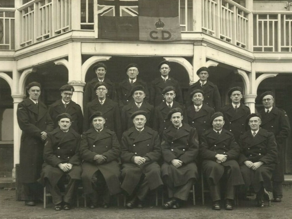 Group of British wardens at stand down in May 1945 wearing Civil Defence greatcoats. Image credit ww2civildefence.co.uk